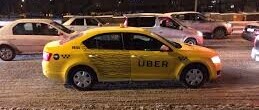 Yellow Uber vehicle