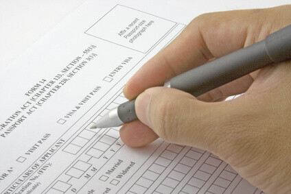 A person filling out an application
