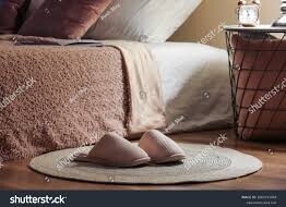 unlight entering a calm bedroom with soft shadows and a neatly made bed—symbolizing the beginning of a mindful morning routin